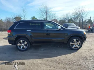 2014 Jeep Grand Cherokee Overland with VIN 1C4RJECG4EC523747, listed as a IAAI auction lot 40802143 with 124,079 mi miles. Bid and sale history available at carsss.com. Image 13.