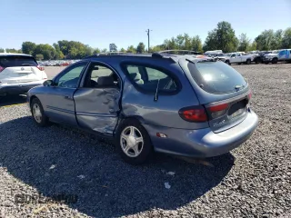 1999 Ford Taurus SE Standard with VIN 1FAFP58U9XG271897, listed as a Copart auction lot 73048784 with 190,518 mi miles and Salvage title. Bid and sale history available at DreamBid. Image 2.