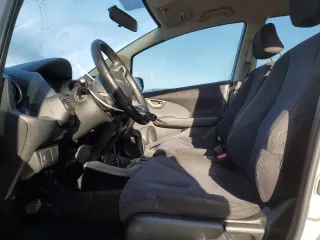 2013 Honda Fit Sport with VIN JHMGE8H5XDC026817, listed as a Copart auction lot 49682795 with 129,618 mi miles and Salvage Title. Bid and sale history available at carsss.com. Image 7.