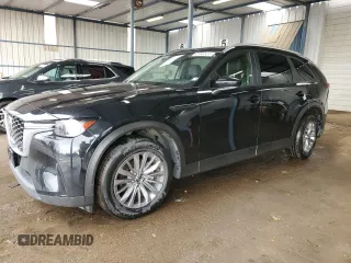 2024 Mazda CX-90 Select z VIN JM3KKAHDXR1163947, wystawiony jako Copart lot #56225205 z przebiegiem 22 340 mil mil oraz Czysty tytuł • Clean title. Historia ofert i sprzedaży dostępna na DreamBid. Obrazek 1.