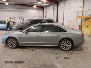 2012 Audi A8 with VIN WAURVAFD7CN021716, listed as a IAAI auction lot 42330229 with 97,359 mi miles and . Bid and sale history available at DreamBid. Image 14.