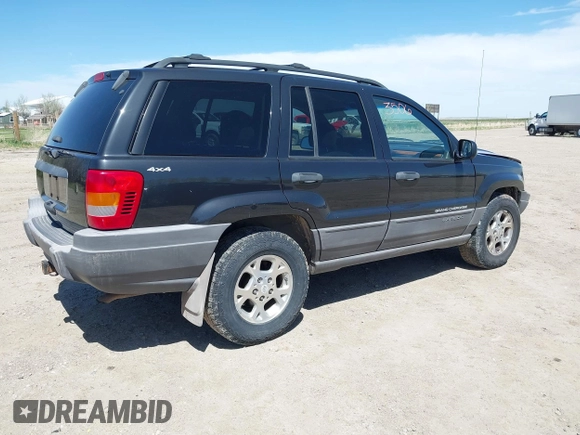 1999 Jeep Grand Cherokee Laredo with VIN 1J4GW58S8XC524502, listed as a IAAI auction lot 42193506 with 147,920 mi miles and . Bid and sale history available at DreamBid. Image 4.