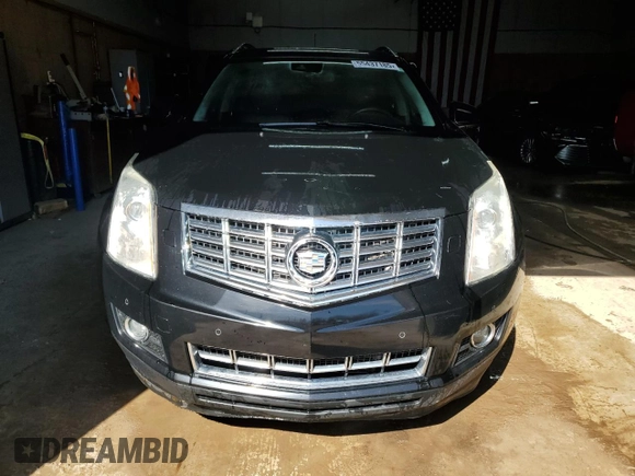 2014 Cadillac SRX Performance Collection z VIN 3GYFNFE31ES627978, wystawiony jako Copart lot #55437185 z przebiegiem 141 759 mil mil oraz Czysty tytuł • Clean title. Historia ofert i sprzedaży dostępna na DreamBid. Obrazek 5.