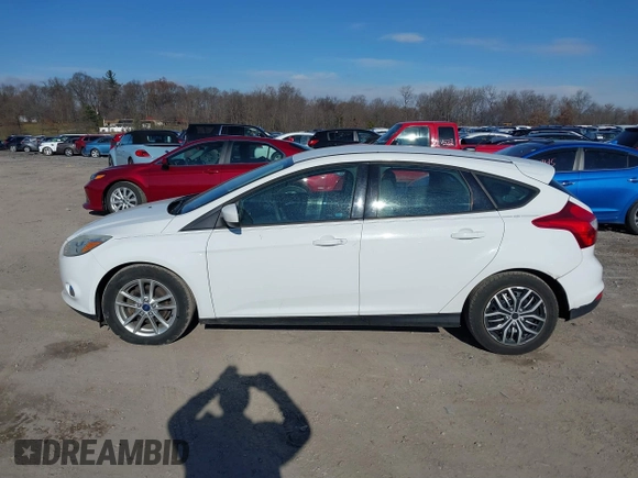 2012 Ford Focus SE z VIN 1FAHP3K29CL265135, wystawiony jako IAAI lot #40989480 z przebiegiem 158 742 mil mil oraz . Historia ofert i sprzedaży dostępna na DreamBid. Obrazek 14.