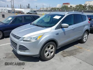 2016 Ford Escape SE with VIN 1FMCU0GX7GUB72822, listed as a IAAI auction lot 42136764 with 98,497 mi miles. Bid and sale history available at carsss.com. Image 2.