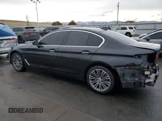 2018 BMW 5 Series 530e xDrive with VIN WBAJB1C5XJB084018, listed as a Copart auction lot 86277124 with 127,517 mi miles and Salvage Title. Bid and sale history available at carsss.com. Image 2.