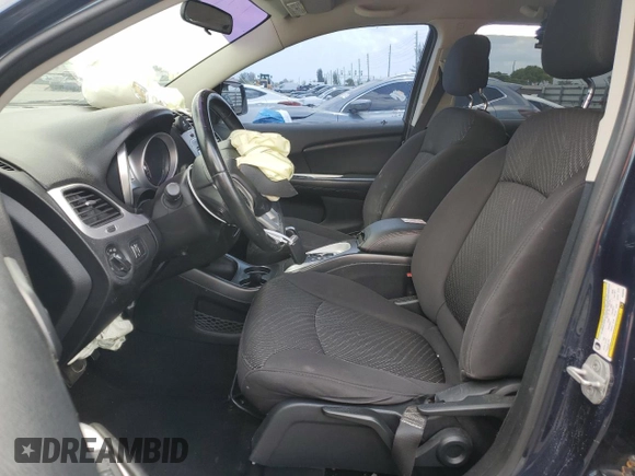 2013 Dodge Journey SE with VIN 3C4PDCAB7DT680055, listed as a Copart auction lot 58241435 with 199,620 mi miles and Salvage title. Bid and sale history available at DreamBid. Image 7.
