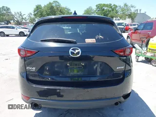 2017 Mazda CX-5 Grand Touring with VIN JM3KFBDL6H0200830, listed as a IAAI auction lot 42005145 with 90,510 mi miles. Bid and sale history available at carsss.com. Image 16.