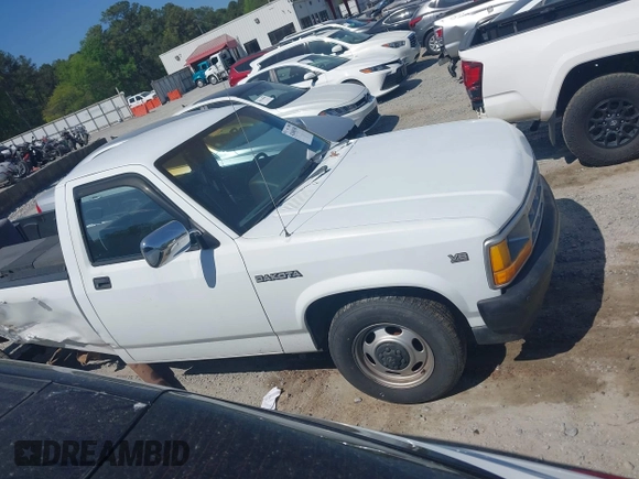1991 Dodge Dakota S z VIN 1B7GL26XXMS302752, wystawiony jako IAAI lot #42060308 z przebiegiem 158 000 mil mil oraz . Historia ofert i sprzedaży dostępna na DreamBid. Obrazek 13.