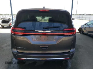 2023 Chrysler Pacifica Touring L with VIN 2C4RC1BG1PR581376, listed as a Copart auction lot 59901915 with 57,411 mi miles and Salvage title. Bid and sale history available at DreamBid. Image 6.