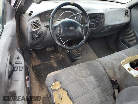 2001 Ford F-150 XL z VIN 1FTRX18W21KA55346, wystawiony jako Copart lot #79252584 z przebiegiem 347 300 mil mil oraz Szkoda całkowita • Salvage title. Historia ofert i sprzedaży dostępna na DreamBid. Obrazek 8.