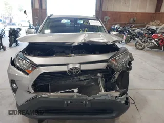 2021 Toyota RAV4 XLE with VIN 2T3P1RFV5MC180890, listed as a IAAI auction lot 42567858 with 56,961 mi miles and . Bid and sale history available at DreamBid. Image 11.