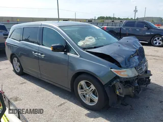 2012 Honda Odyssey Touring with VIN 5FNRL5H90CB029115, listed as a IAAI auction lot 42471760 with 184,124 mi miles and . Bid and sale history available at DreamBid. Image 1.