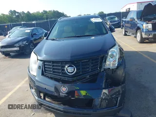 2014 Cadillac SRX Performance Collection with VIN 3GYFNCE39ES613051, listed as a IAAI auction lot 42113063 with 82,952 mi miles and . Bid and sale history available at carsss.com. Image 12.