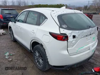 2019 Mazda CX-5 Sport with VIN JM3KFBBM2K0629966, listed as a IAAI auction lot 41953702 with 48,496 mi miles and . Bid and sale history available at DreamBid. Image 3.