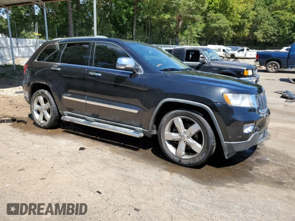 2012 Jeep Grand Cherokee Overland with VIN 1C4RJECTXCC227769, listed as a Copart auction lot 68760174 with 144,537 mi miles and Salvage Title. Bid and sale history available at carsss.com. Image 4.