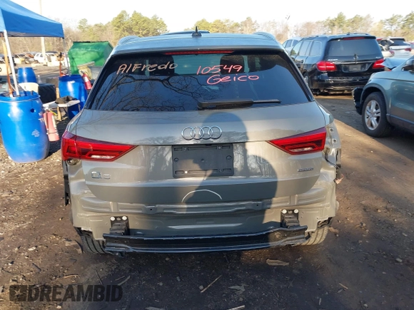 2021 Audi Q3 Premium with VIN WA1AUCF34M1099668, listed as a IAAI auction lot 41990226 with 69,866 mi miles and . Bid and sale history available at DreamBid. Image 16.