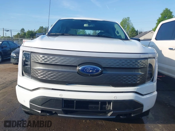 2023 Ford F-150 Lightning Pro with VIN 1FTVW1EL6PWG34059, listed as a IAAI auction lot 42010900 with 20,759 mi miles and . Bid and sale history available at DreamBid. Image 12.
