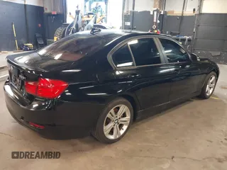 2014 BMW 3 Series 328i xDrive with VIN WBA3B3G50ENR83599, listed as a IAAI auction lot 42106340 with 195,309 mi miles. Bid and sale history available at carsss.com. Image 4.