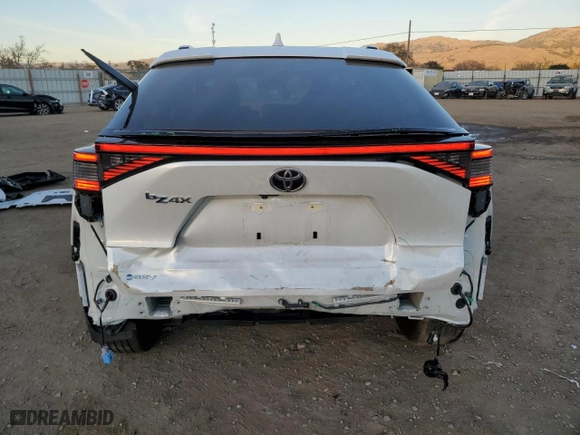 2024 Toyota bZ4X XLE with VIN JTMAAAAA7RA034622, listed as a Copart auction lot 87950735 with 11,278 mi miles and Salvage Title. Bid and sale history available at carsss.com. Image 6.