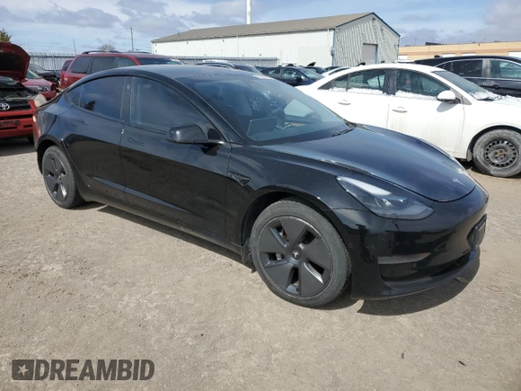 2021 Tesla Model 3 Standard Range Plus with VIN 5YJ3E1EA7MF053663, listed as a Copart auction lot 51982265 with 90,529 mi miles and Salvage Title. Bid and sale history available at DreamBid. Image 4.