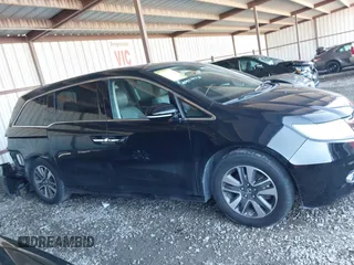 2014 Honda Odyssey Touring with VIN 5FNRL5H94EB110590, listed as a IAAI auction lot 42092929 with 242,338 mi miles and . Bid and sale history available at DreamBid. Image 14.