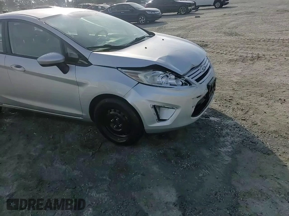 2013 Ford Fiesta S z VIN 3FADP4AJ9DM140665, wystawiony jako Copart lot #61634485 z przebiegiem 165 124 mil mil oraz Szkoda całkowita • Salvage title. Historia ofert i sprzedaży dostępna na DreamBid. Obrazek 13.