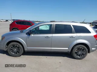 2017 Dodge Journey SE z VIN 3C4PDCAB1HT573511, wystawiony jako IAAI lot #41984865 z przebiegiem 128 721 mil mil oraz . Historia ofert i sprzedaży dostępna na DreamBid. Obrazek 14.
