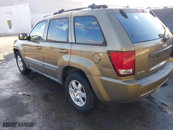 2009 Jeep Grand Cherokee Laredo with VIN 1J8GS48K79C516320, listed as a IAAI auction lot 41353131 with 166,739 mi miles. Bid and sale history available at carsss.com. Image 3.