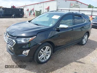 2021 Chevrolet Equinox Premier with VIN 2GNAXNEV5M6151910, listed as a IAAI auction lot 42110010 with 45,911 mi miles and . Bid and sale history available at DreamBid. Image 2.