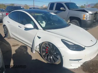 2021 Tesla Model 3 Performance with VIN 5YJ3E1EC6MF926448, listed as a IAAI auction lot 41240309 with 39,386 mi miles and . Bid and sale history available at DreamBid. Image 1.