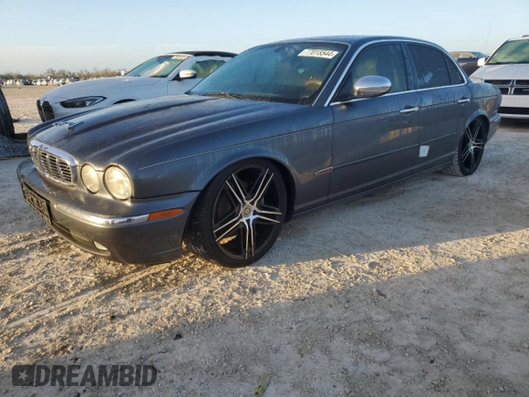 2004 Jaguar XJ with VIN SAJEA74C24SG09038, listed as a Copart auction lot 77015544 with Not Provided miles and Salvage Title. Bid and sale history available at DreamBid. Image 1.
