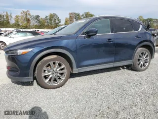 2021 Mazda CX-5 Signature with VIN JM3KFBEY3M0439658, listed as a Copart auction lot 74534464 with 50,816 mi miles and Salvage Title. Bid and sale history available at carsss.com. Image 1.