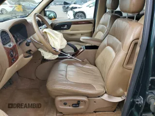 2003 GMC Envoy SLT z VIN 1GKET16P936191818, wystawiony jako Copart lot #53270645 z przebiegiem 130 357 mil mil oraz Szkody całkowita. Historia ofert i sprzedaży dostępna na DreamBid. Obrazek 7.