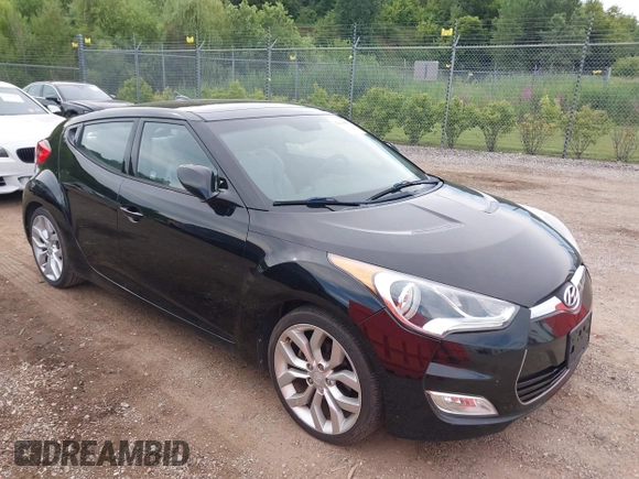 2012 Hyundai Veloster w/Gray Int with VIN KMHTC6AD6CU028810, listed as a IAAI auction lot 42818888 with 149,283 mi miles and . Bid and sale history available at DreamBid. Image 1.