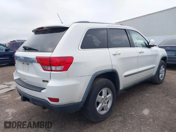 2012 Jeep Grand Cherokee Laredo with VIN 1C4RJFAG5CC224032, listed as a IAAI auction lot 42069334 with 106,614 mi miles. Bid and sale history available at carsss.com. Image 4.