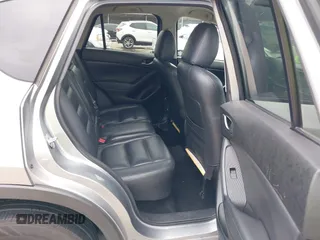 2014 Mazda CX-5 Touring z VIN JM3KE2CY8E0369145, wystawiony jako IAAI lot #42462985 z przebiegiem 155 480 mil mil oraz . Historia ofert i sprzedaży dostępna na DreamBid. Obrazek 8.