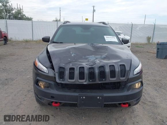 2015 Jeep Cherokee Trailhawk with VIN 1C4PJMBSXFW654754, listed as a IAAI auction lot 39935278 with 128,076 mi miles and . Bid and sale history available at DreamBid. Image 6.