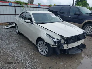 2014 Cadillac CTS Luxury RWD with VIN 1G6AR5S30E0153180, listed as a IAAI auction lot 42461408 with 143,722 mi miles and . Bid and sale history available at DreamBid. Image 1.