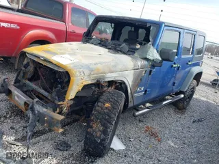 2009 Jeep Wrangler Unlimited X with VIN 1J4GA39199L724445, listed as a IAAI auction lot 41722542 with 1 mi miles. Bid and sale history available at carsss.com. Image 2.
