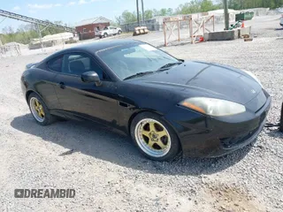 2007 Hyundai Tiburon GS z VIN KMHHM66D87U255336, wystawiony jako IAAI lot #42035856 z przebiegiem 177 338 mil mil oraz . Historia ofert i sprzedaży dostępna na DreamBid. Obrazek 1.
