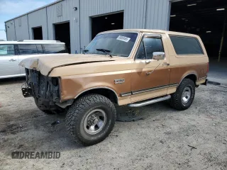 1987 Ford Bronco Custom with VIN 1FMEU15H6HLA11430, listed as a Copart auction lot 89069465 with 2,155 mi miles and Salvage Title. Bid and sale history available at carsss.com. Image 1.
