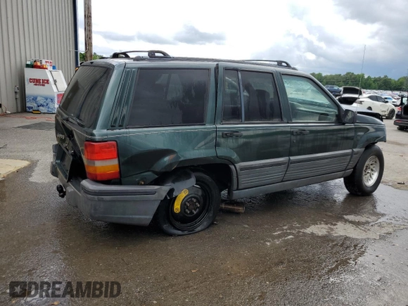 1995 Jeep Grand Cherokee Laredo with VIN 1J4FX58S8SC773884, listed as a Copart auction lot 56572555 with 424,126 mi miles and Salvage title. Bid and sale history available at DreamBid. Image 3.