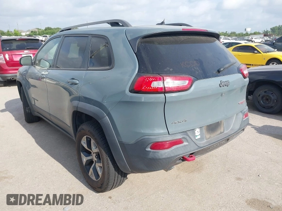 2014 Jeep Cherokee Trailhawk z VIN 1C4PJMBS2EW161276, wystawiony jako IAAI lot #42283358 z przebiegiem 135 201 mil mil oraz . Historia ofert i sprzedaży dostępna na DreamBid. Obrazek 3.