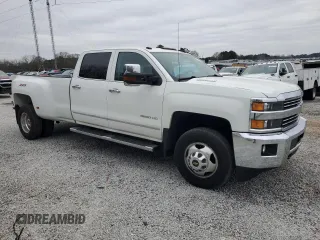 2015 Chevrolet Silverado 3500HD LTZ with VIN 1GC4K0C8XFF573426, listed as a Copart auction lot 85896784 with 104,104 mi miles and Salvage Title. Bid and sale history available at DreamBid. Image 1.