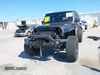 2014 Jeep Wrangler Unlimited Sport with VIN 1C4BJWDG4EL295044, listed as a IAAI auction lot 41997837 with 143,447 mi miles. Bid and sale history available at carsss.com. Image 12.