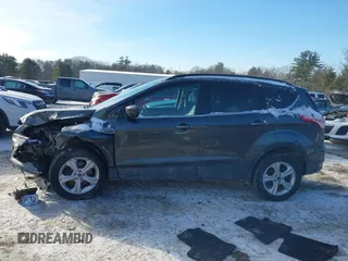 2016 Ford Escape SE with VIN 1FMCU9GX1GUC32307, listed as a IAAI auction lot 41395399 with 142,664 mi miles. Bid and sale history available at carsss.com. Image 14.