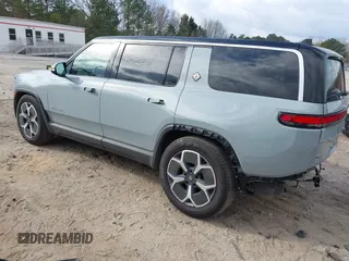 2024 Rivian R1S Adventure with VIN 7PDSGBBA1RN040036, listed as a IAAI auction lot 41694635 with 13,855 mi miles. Bid and sale history available at carsss.com. Image 3.