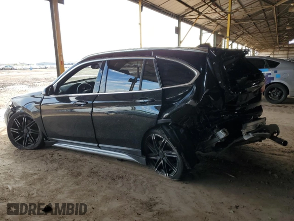 2018 BMW X1 sDrive28i with VIN WBXHU7C34J5L05725, listed as a Copart auction lot 49228475 with 69,994 mi miles and Salvage Title. Bid and sale history available at carsss.com. Image 2.
