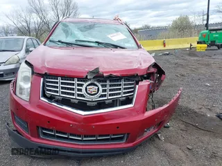 2015 Cadillac SRX Luxury Collection z VIN 3GYFNBE35FS574812, wystawiony jako IAAI lot #42037577 z przebiegiem 94 727 mil mil oraz . Historia ofert i sprzedaży dostępna na DreamBid. Obrazek 13.